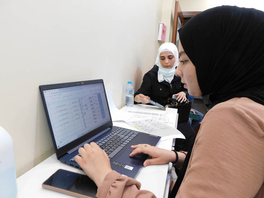 Recording the data of the students who need eyeglasses and handing it to Dr Yaman Al Muradi.