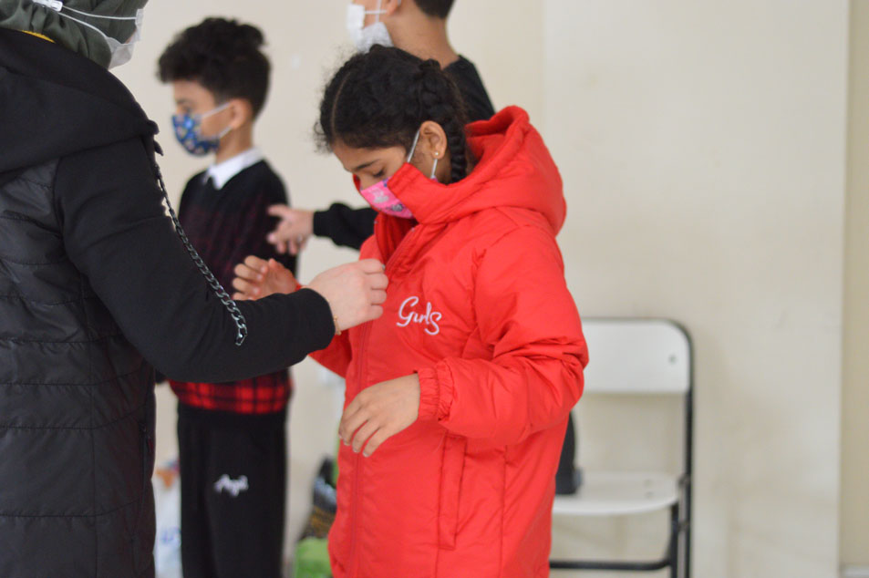 providing the kids in winter time with jackets and some clothes.