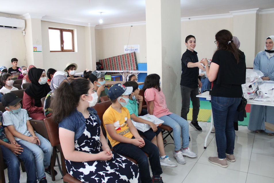 Providing students with clothes by Mrs Mirna Barq.