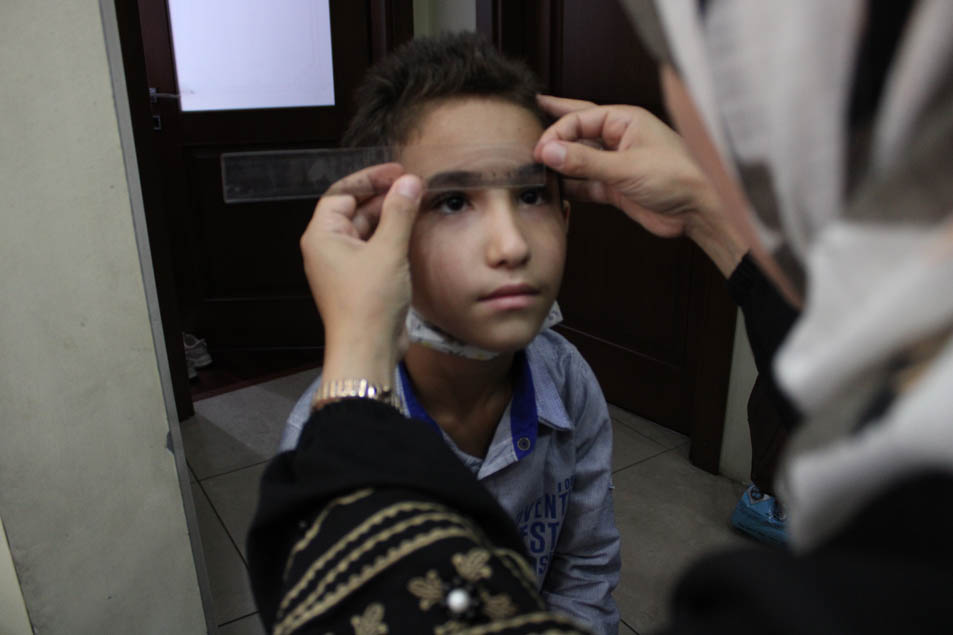 Recording the data of the students who need eyeglasses and handing it to Dr Yaman Al Muradi.